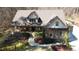 Charming home with stone accents, lush landscaping, and a welcoming front porch at 5640 Bella Terra Ct, Wake Forest, NC 27587