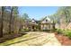 Charming home with a manicured lawn, mature trees, and a welcoming front porch at 5640 Bella Terra Ct, Wake Forest, NC 27587
