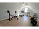 Spacious gym with hardwood floors, high ceiling, and plenty of gym equipment at 5640 Bella Terra Ct, Wake Forest, NC 27587