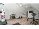 Large gym area with wood floors, weight equipment, and inspiring wall decor at 5640 Bella Terra Ct, Wake Forest, NC 27587