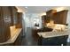 Modern kitchen with stainless steel appliances, central island and breakfast bar at 5640 Bella Terra Ct, Wake Forest, NC 27587