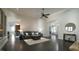 Spacious living room with dark hardwood floors, fireplace, and easy access to other parts of the home at 5640 Bella Terra Ct, Wake Forest, NC 27587
