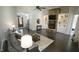Bright living room with stone fireplace, built-ins, and modern furniture at 5640 Bella Terra Ct, Wake Forest, NC 27587