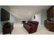 Finished basement features wet bar, hardwood cabinets, and comfortable furniture at 5640 Bella Terra Ct, Wake Forest, NC 27587