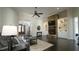 Comfortable living room features stone fireplace, gray sofa, and an inviting front door at 5640 Bella Terra Ct, Wake Forest, NC 27587
