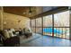 Cozy screened porch with wicker furniture, offering scenic views of the outdoors at 5640 Bella Terra Ct, Wake Forest, NC 27587