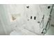 A modern and glass enclosed shower features beautiful marble tiling and sleek black fixtures at 5640 Bella Terra Ct, Wake Forest, NC 27587