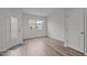 Bright dining area featuring hardwood floors, modern light fixture, and access to the exterior at 6351 Perry Creek Rd, Raleigh, NC 27616
