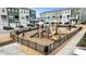 Community playground featuring slides, climbing structures and a secure fenced area among townhouse community at 6351 Perry Creek Rd, Raleigh, NC 27616