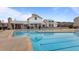Community pool with a clubhouse, offering residents a place to relax and socialize in a resort-like setting at 6351 Perry Creek Rd, Raleigh, NC 27616
