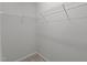 A walk-in closet with wire shelving and neutral paint, ready to be organized and utilized for storage at 6351 Perry Creek Rd, Raleigh, NC 27616