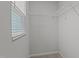 A walk-in closet with a window and wire shelving for organized storage at 6351 Perry Creek Rd, Raleigh, NC 27616