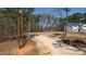 Cleared lot ready for construction with wooded surrounding and a home nearby at 680 Jasmine Rd, Fuquay Varina, NC 27526