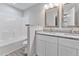 Bathroom features double sinks with granite countertops and a shower and tub at 680 Jasmine Rd, Fuquay Varina, NC 27526