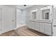 Bright bathroom with double vanity, granite countertops, and a walk-in shower with a white surround at 680 Jasmine Rd, Fuquay Varina, NC 27526