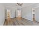 Spacious bedroom featuring a ceiling fan, a large closet, and multiple doors leading to other rooms at 680 Jasmine Rd, Fuquay Varina, NC 27526