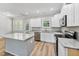 Kitchen with white cabinetry, granite countertops, and stainless appliances create a modern cooking space at 680 Jasmine Rd, Fuquay Varina, NC 27526