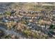 Aerial view of a residential neighborhood with community pool surrounded by lush trees at 7 Starwood Ln, Durham, NC 27712