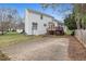 The home has a wooden deck, brick paver patio and basketball court in the yard at 7 Starwood Ln, Durham, NC 27712