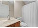 Bathroom featuring a single vanity and shower-tub combo with curtain at 7 Starwood Ln, Durham, NC 27712