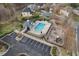 Aerial view of the fenced community pool with a playground and picnic area at 7 Starwood Ln, Durham, NC 27712
