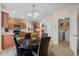 Open-concept kitchen with a dining area and access to the laundry room with modern appliances at 7 Starwood Ln, Durham, NC 27712
