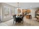 Spacious eat-in kitchen featuring stainless appliances, breakfast bar, light wood cabinets and access to the back deck at 7 Starwood Ln, Durham, NC 27712
