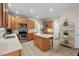 Spacious kitchen with stainless steel appliances, wooden cabinets, and an island with seating for casual dining at 7 Starwood Ln, Durham, NC 27712