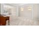 Spacious living room featuring elegant columns, carpet flooring and a chandelier at 7 Starwood Ln, Durham, NC 27712