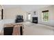 Cozy living room with a fireplace, comfortable seating, and neutral decor, creating an inviting atmosphere at 7 Starwood Ln, Durham, NC 27712