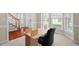 Well-lit home office with large windows and neutral carpet flooring at 7 Starwood Ln, Durham, NC 27712