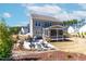 Backyard view featuring a screened porch, outdoor seating area, and beautifully landscaped surroundings at 8132 Baronleigh Ln, Wake Forest, NC 27587