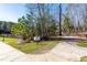 A wide concrete walking path through a forested area near a pond at 8132 Baronleigh Ln, Wake Forest, NC 27587