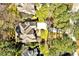 Aerial view showcasing a well-maintained home surrounded by lush landscaping and mature trees at 81517 Alexander, Chapel Hill, NC 27517