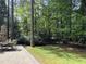 A tranquil backyard showing lawn and wooded views at 81517 Alexander, Chapel Hill, NC 27517