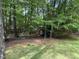 Lush backyard with mature trees, showing shade and open space at 81517 Alexander, Chapel Hill, NC 27517