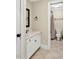 Bathroom with a marble sink and vanity, ceramic tile floors, and view to a shower and toilet at 81517 Alexander, Chapel Hill, NC 27517