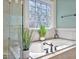 Serene bathroom featuring a soaking tub with jets, complemented by stylish fixtures and a peaceful ambiance at 81517 Alexander, Chapel Hill, NC 27517