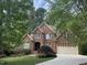 Charming two-story red brick home featuring a well-manicured lawn and a spacious two-car garage at 81517 Alexander, Chapel Hill, NC 27517