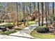 Charming two-story red brick home featuring a well-manicured lawn and a spacious two-car garage at 81517 Alexander, Chapel Hill, NC 27517