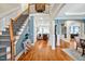 Elegant foyer with hardwood floors, staircase, and archways leading to open living spaces at 81517 Alexander, Chapel Hill, NC 27517
