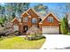 Charming brick home with a manicured front lawn and a two-car garage at 81517 Alexander, Chapel Hill, NC 27517