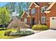 Elegant brick home with manicured landscaping and a welcoming front entrance at 81517 Alexander, Chapel Hill, NC 27517