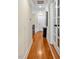 Long hallway featuring hardwood floors and stylish doors at 81517 Alexander, Chapel Hill, NC 27517