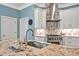 Modern kitchen featuring granite countertops, stainless steel appliances, and stylish white cabinetry at 81517 Alexander, Chapel Hill, NC 27517
