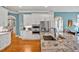 Open kitchen featuring white cabinets, granite countertops, and modern stainless steel appliances at 81517 Alexander, Chapel Hill, NC 27517