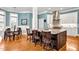 Stylish kitchen featuring granite island with seating, stainless appliances, and hardwood floors at 81517 Alexander, Chapel Hill, NC 27517