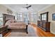 Spacious main bedroom boasts tray ceilings, a sitting area, and large windows overlooking the outdoor landscape at 81517 Alexander, Chapel Hill, NC 27517