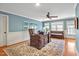 Well-lit office with a large desk, tufted couch, and natural light at 81517 Alexander, Chapel Hill, NC 27517
