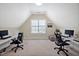 Bright office space with multiple workstations, natural light, and a neutral color scheme at 81517 Alexander, Chapel Hill, NC 27517